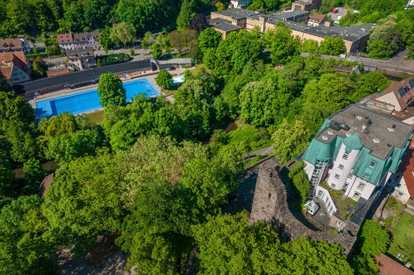 Bird's eye view of the swimming pool next to green trees and buildings, Rabeneck Youth Hostel, Pforzheim, Germany, Europe