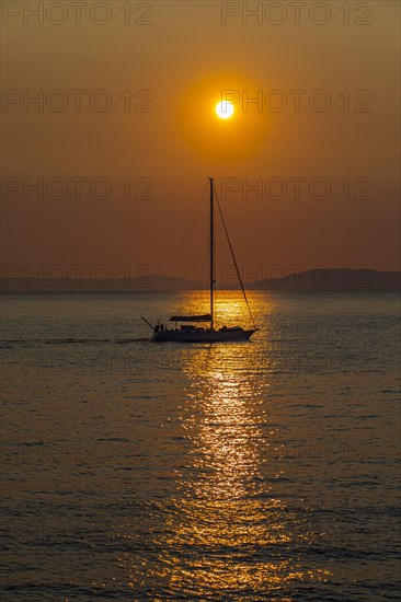 Sailing ship at sunrise in the bay of Gaia di Mola, off Porto Azzurro, Elba, Tuscan Archipelago, Tuscany, Italy, Europe