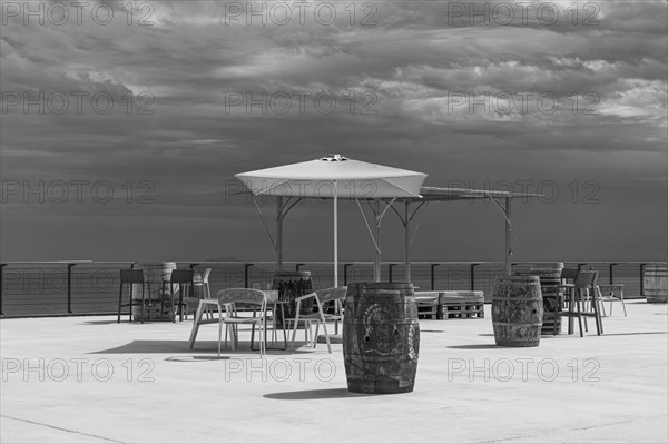 Wine barrels on the terrace of the Tenuta delle Ripalte winery, black and white photo, Elba, Tuscan Archipelago, Tuscany, Italy, Europe