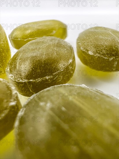 Green mint candies on isolated background with copy space. View of green mint candies on white background with space for text