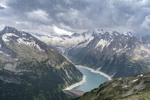 Mountain landscape, view of Schlegeis reservoir with dam wall, glaciated rocky mountain peaks Hoher Weisszint and Hochfeiler with Schlegeiskees glacier, Berliner Hoehenweg, Zillertal Alps, Tyrol, Austria, Europe