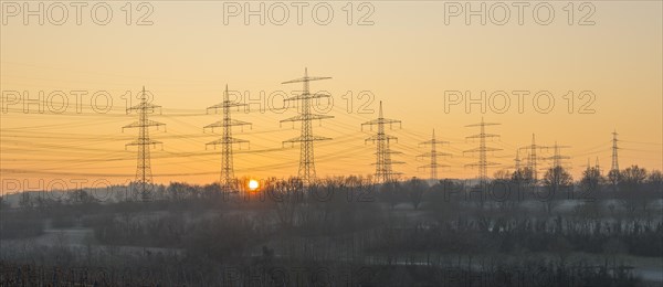 Power poles, overhead lines, sunrise, sun, panorama, Baden-Wuerttemberg, Germany, Europe