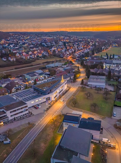 Aerial photo of a town at dusk with illuminated sky, Christmas tree on the roof, Black Forest, Gechingen, Germany, Europe