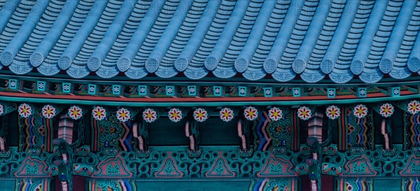 Seoul, South Korea, March 18, 2017:Tiled roof of Seoul's Gyeong Bok Gung Palace in stunning colors of green, blue, red and yellow, Asia