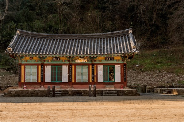 Prayer hall at Buddhist temple on sunny autumn morning