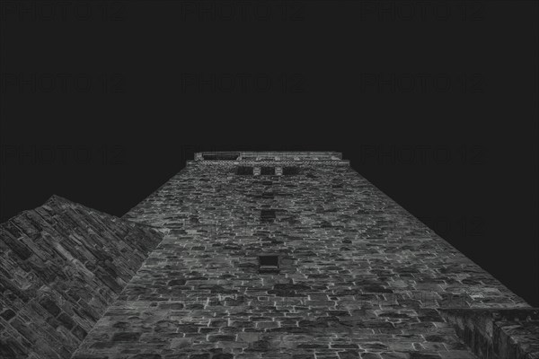View from below of an old tower in black and white at night, creates a mystical atmosphere, Hauptkirche Sonnborn, Wuppertal Sonnborn, North Rhine-Westphalia, Germany, Europe