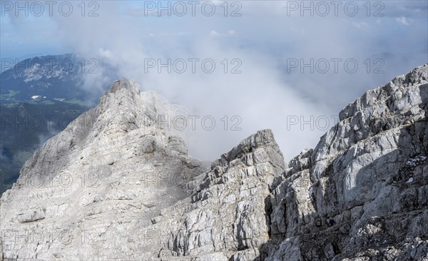 Rocky mountain ridge with clouds, Watzmann crossing, at the summit of the Watzmann Mittelspitze, Berchtesgaden National Park, Berchtesgaden Alps, Bavaria, Germany, Europe