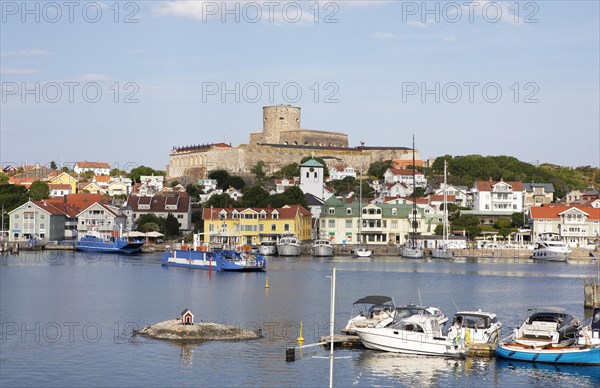 Ferry in the harbour of the archipelago island Marstrandsoe, behind the fortress Carlsten, Marstrand, province Vaestra Goetalands laen, Sweden, Europe