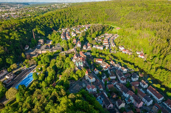 Aerial view of a town on the slope of a wooded hill with visible green areas, Pforzheim, Germany, Europe