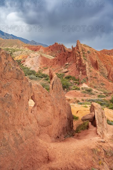 Eroded mountain landscape, sandstone cliffs, canyon with red and orange rock formations, Konorchek Canyon, Chuy, Kyrgyzstan, Asia