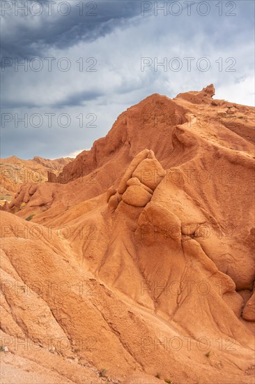 Eroded mountain landscape, sandstone cliffs, canyon with red and orange rock formations, Konorchek Canyon, Chuy, Kyrgyzstan, Asia