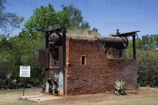 German decommissioned steam engine from 1904 at Lake Otjikoto, used as a pump to supply drinking water to the town of Tsumeb in Namibia