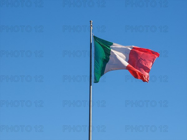 Italian flag over blue sky