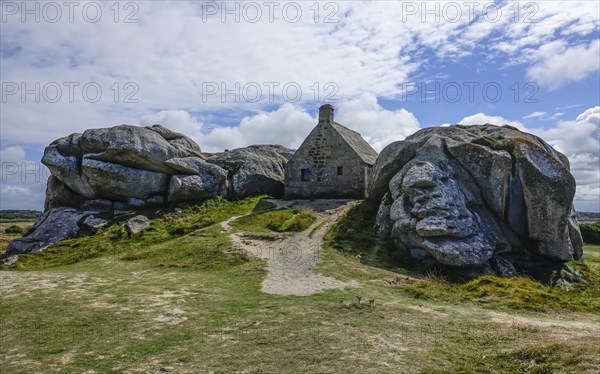 Former village of Meneham on the Atlantic coast with partly thatched houses between granite rocks, now an open-air museum, Menez Ham, Kerlouan, Finistere Penn ar Bed department, Brittany Breizh region, France, Europe