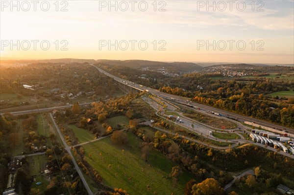 Historical aerial view of a motorway in front of reconstruction, at dusk with moving traffic, Pforzheim, Germany, Europe
