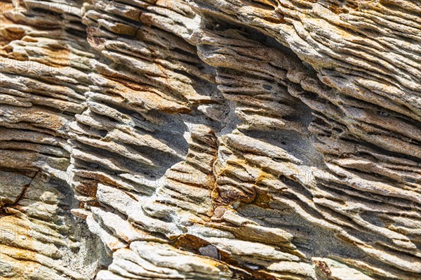 Coloured, ferruginous mineral sandstone on Topinetti beach, near Rio Marina, Elba, Tuscan Archipelago, Tuscany, Italy, Europe