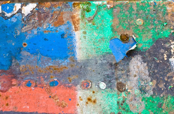 Colourful pattern of peeling paint and rust on a metal surface, weathering with blue, white and green paint, symbol of decay, vacancy, need for renovation, ageing, background, Mecklenburg-Western Pomerania, Germany, Europe