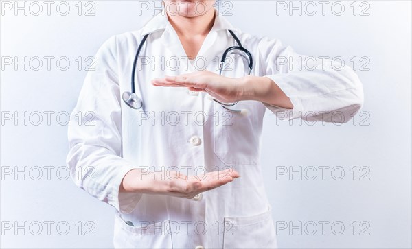 Female doctor hands presenting something isolated. Hands of female doctor holding something isolated