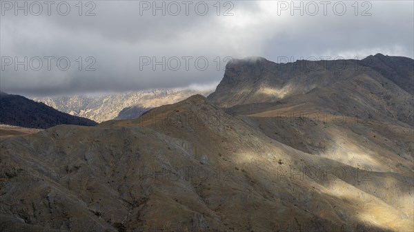 Low hanging clouds in the mountain landscape at the Tizi-n-Tichka pass road, High Atlas, Morocco, Africa