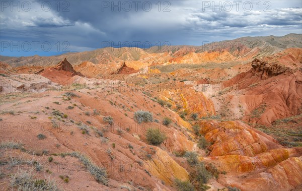 Eroded mountain landscape, sandstone cliffs, canyon with red and orange rock formations, Konorchek Canyon, Chuy, Kyrgyzstan, Asia