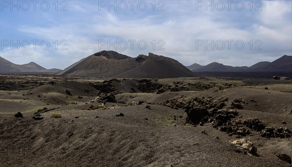 Volcanic landscape with view of the Caldera de Los Cuervos, Timanfaya National Park, Lanzarote, Canary Islands, Spain, Europe