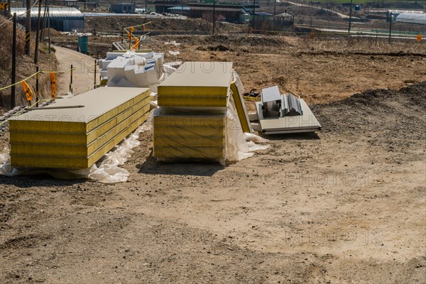 Chungju, South Korea, March 22, 2020: For editorial use only. Insulation panels stacked on ground of rural construction site, Asia