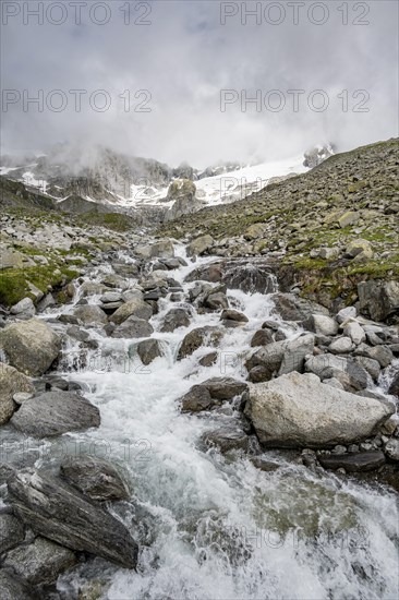 Mountain stream Furtschaglbach, behind rocky mountains with glacier Furtschaglkees, Furtschaglhaus, Berliner Hoehenweg, Zillertal, Tyrol, Austria, Europe