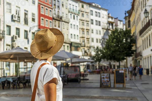 Woman sightseeing beautiful town, Coimbra, Portugal, Europe