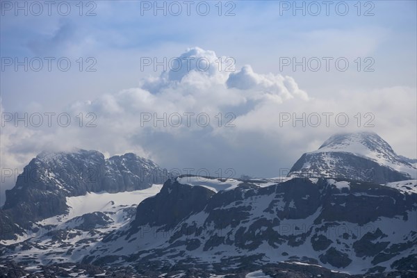 Amazing mountains panorama from 5 Fingers viewing platform in the shape of a hand with five fingers on Mount Krippenstein in the Dachstein Mountains of Upper Austria, Salzkammergut region, Austria, Europe