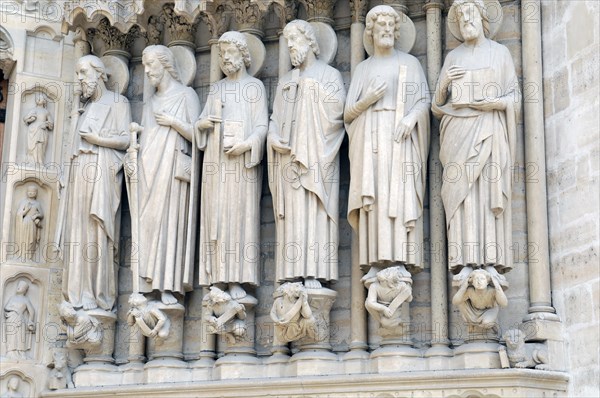 Figures of saints, detail on the Gothic entrance portal of Notre Dame de Paris Cathedral, Paris, France, Europe