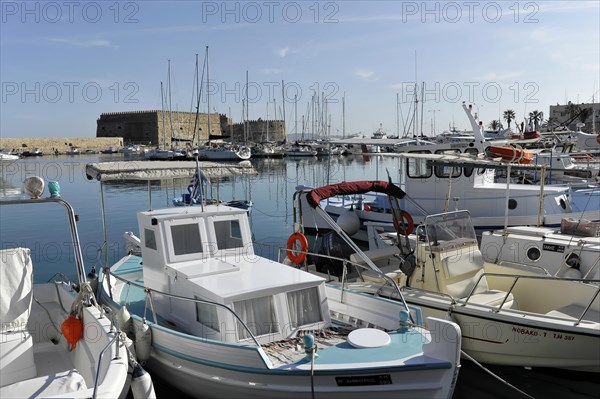 Fishing boats in the Venetian harbour of Heraklion, island of Crete, Greece, Europe