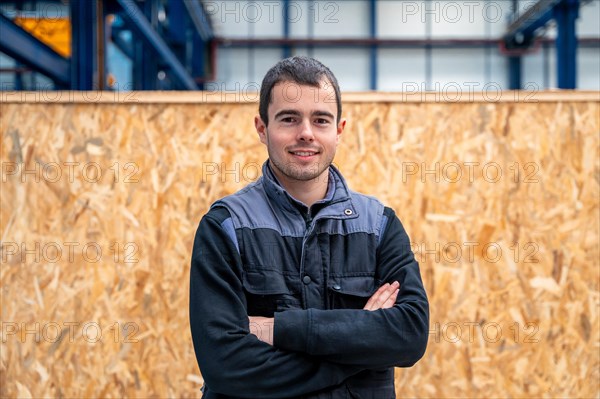 Portrait of a manual worker standing proud in a factory