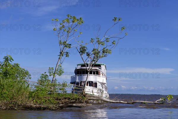 Traditional wooden boat anchored in the Itapicuru laguna, Para state, Brazil, South America