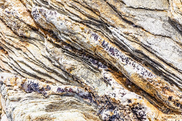 Coloured, ferruginous mineral sandstone on Topinetti beach, near Rio Marina, Elba, Tuscan Archipelago, Tuscany, Italy, Europe