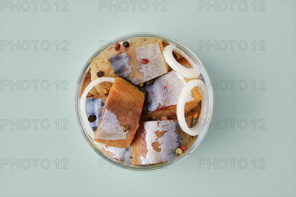 Top view of marinated mackerel in a glass jar