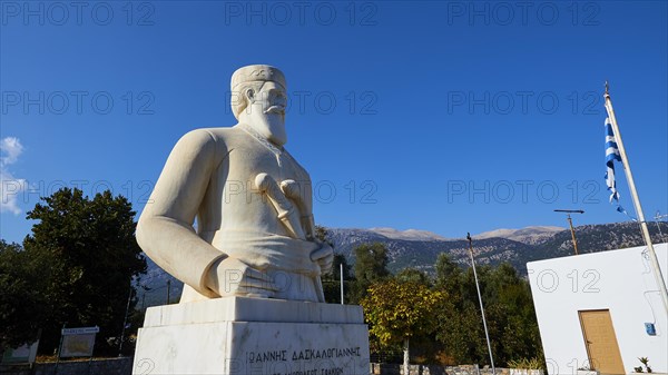 Statue of the resistance fighter and partisan Yannis Daskaloyannis, statue of a historical figure in front of a Greek background, Anopolis, Sfakia, West Crete, Crete, Greece, Europe
