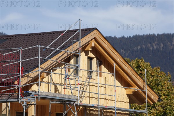 Scaffolded wooden house, renovation, construction site, Garmisch-Partenkirchen, Upper Bavaria, Bavaria, Germany, Europe
