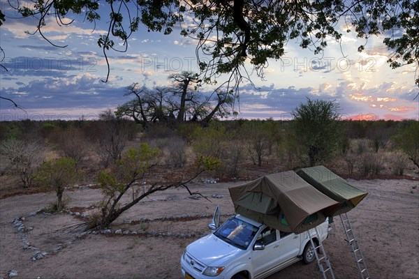 Tsumkwe, 13.11.2011, Camping under a Baobab in Namibia |Camping under a Baobab in Namibia. | (Africa) (Original as digital file 12, 3 Mio Pixel, Photo: artvertise fotodesign, Hohenzollernstr. 11, 33330 Guetersloh, Tel. 05241, 241 86. mobile: 0171 444 29 19 u. 0160 700 54 85, email: info@artvertise.de -subject to the legal tax rate of 7 % VAT. Publication only for a fee, copyright notice and specimen copy. Bank account: Deutsche Bank 24 BLZ 480 700 40 Account no. 326 3118)