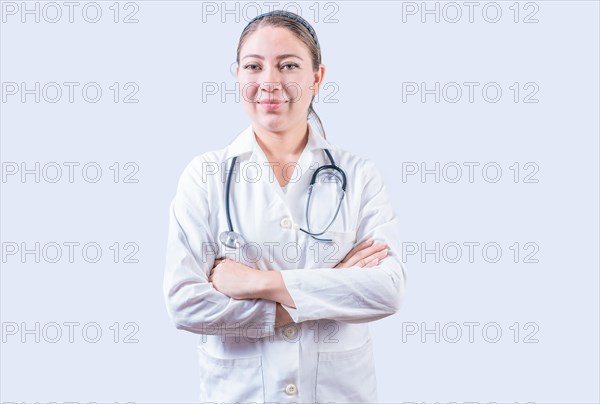 Successful female doctor with arms crossed isolated. Portrait of smiling female doctor with crossed arms isolated