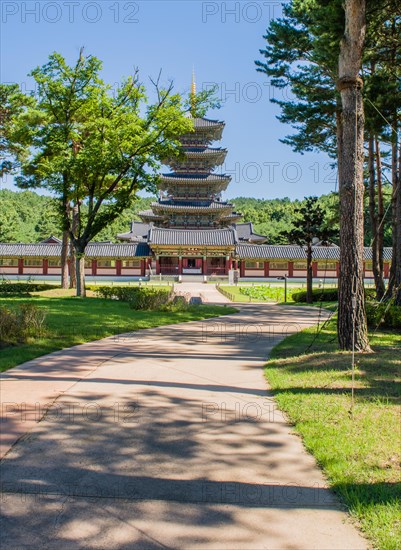 Buyeo, South Korea, July 7, 2018: Sidewalk leading to main gate of Neungsa Baekje Temple with five story pagoda, Asia