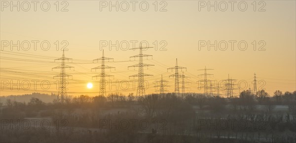 Power poles, overhead lines, sunrise, sun, panorama, Baden-Wuerttemberg, Germany, Europe