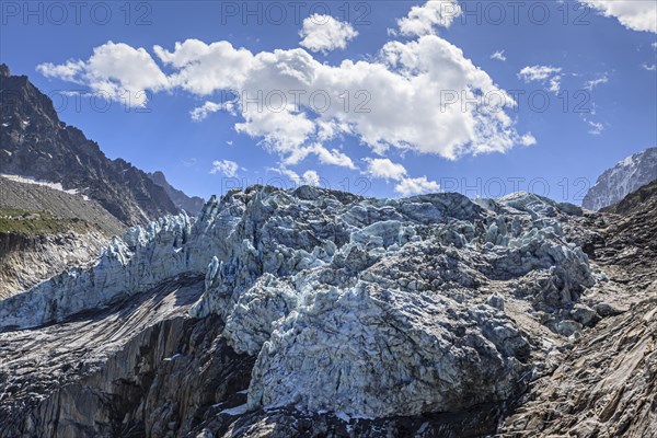 Glacier tongue at midday light in front of mountains, backlight, D'Argentiere glacier, Mont Blanc massif, French Alps, Chamonix, France, Europe