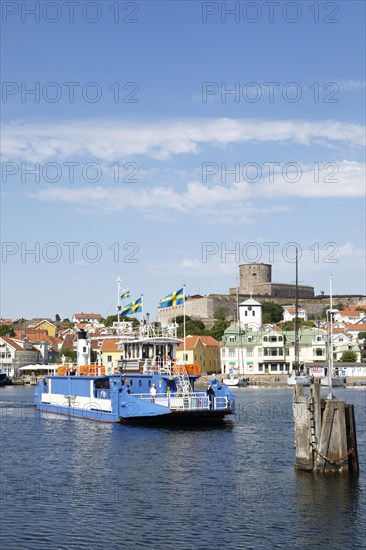 Ferry in the harbour of the archipelago island Marstrandsoe, behind the fortress Carlsten, Marstrand, province Vaestra Goetalands laen, Sweden, Europe
