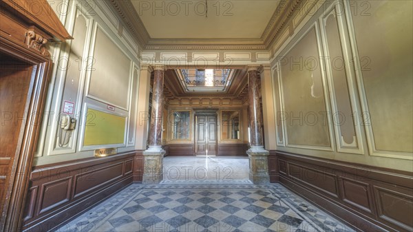 A hallway in a historic building with chequered floor tiles and pillar panelling, Villa Woodstock, Lost Place, Wuppertal, North Rhine-Westphalia, Germany, Europe