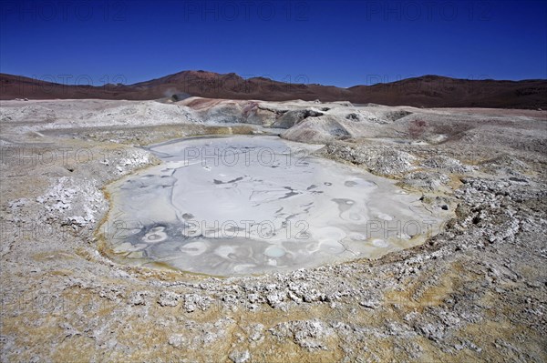 Mud lakes and steam pools with boiling mud in geothermal field Sol de Manana, Altiplano, Bolivia, South America