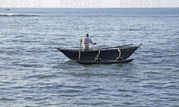 Fishing using traditional outrigger canoes, Mirissa, Sri Lanka, Asia