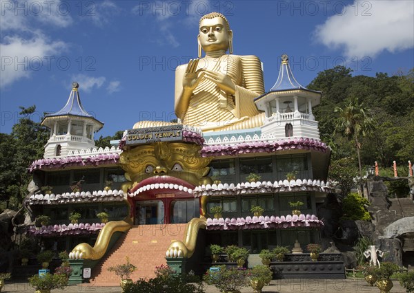 Giant Golden Buddha statue at Dambulla cave temple complex, Sri Lanka, Asia