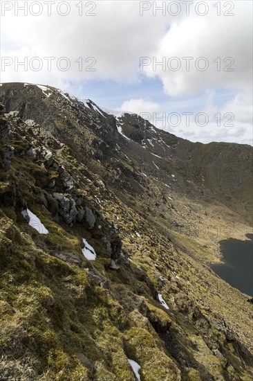 Helvellyn mountain peak and Red Tarn corrie lake, Lake District, Cumbria, England, UK