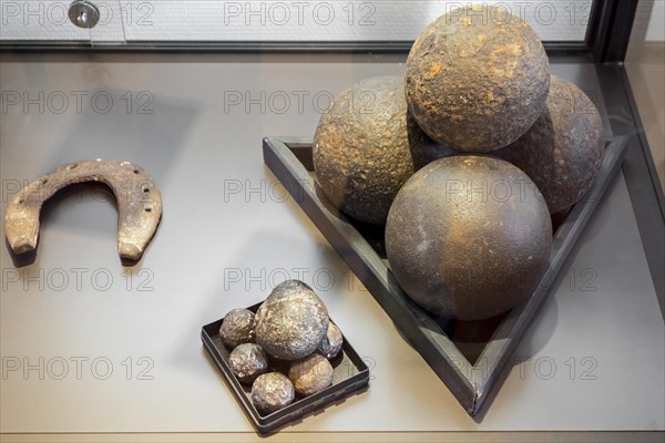 Horseshoe, cannonballs and grapeshot balls, findings from the battlefield in Le Caillou, Napoleon's Last HQ, Headquarters, museum about the 1815 Napoleonic war, the Battle of Waterloo at Vieux-Genappe, Belgium, Europe