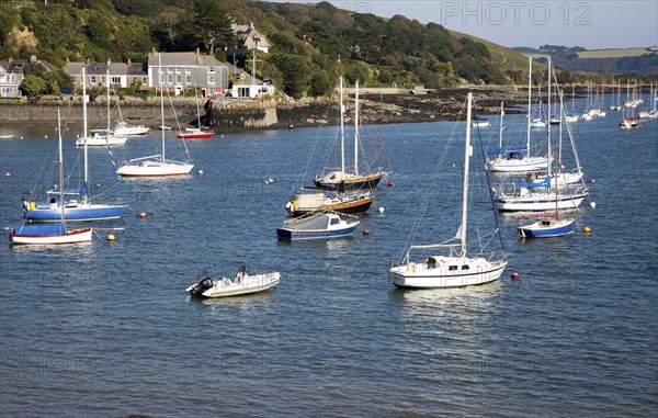 Yachts at moorings on River Fal, Flushing, Cornwall, England, UK